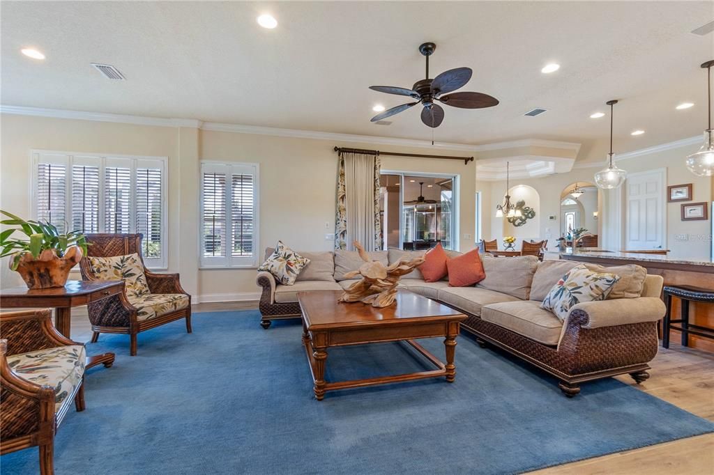 Opens up to Family room w/Windows Galore & Sliders to Lanai & Pool