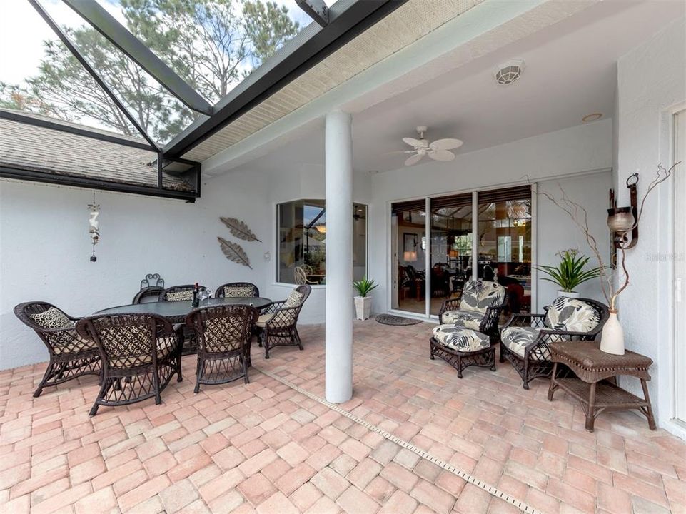 Step outside to the paver lanai overlooking the large heated pool