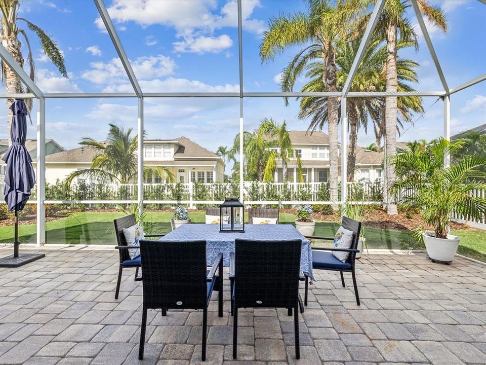 Dine under the stars worry-free from mosquitos and bugs under this expansive enclosure with a vaulted ceiling.