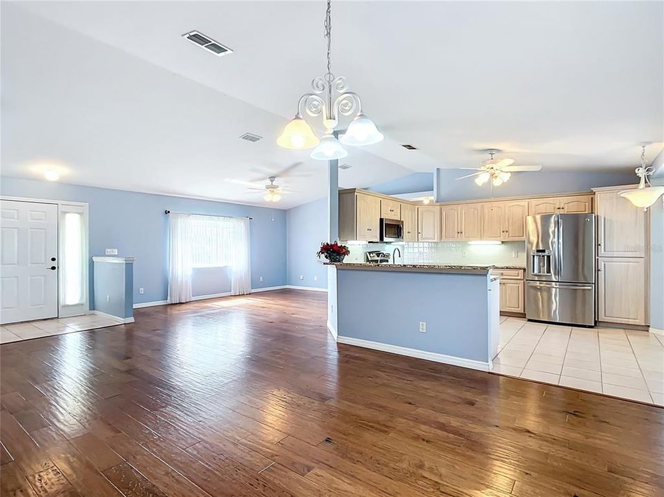 dining room looking into kitchen and living room