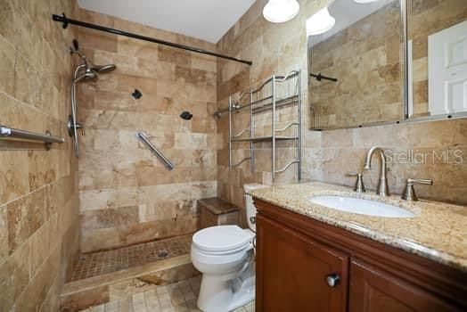 Walk in shower with seat and granite countertops