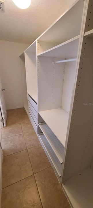 Huge Walk In Closet with Built Ins