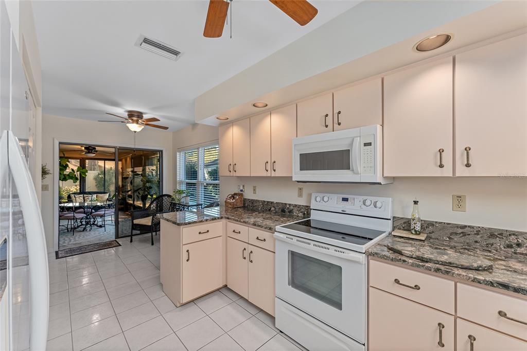 kitchen with window overlooking front and breakfast nook