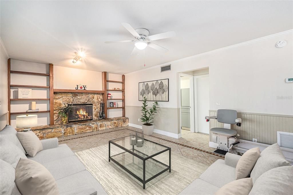 Family room with wood burning fireplace.  Bruno brand chair lift goes to all floors.