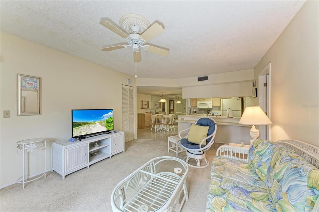 Living Room opens to Dining Room and Kitchen