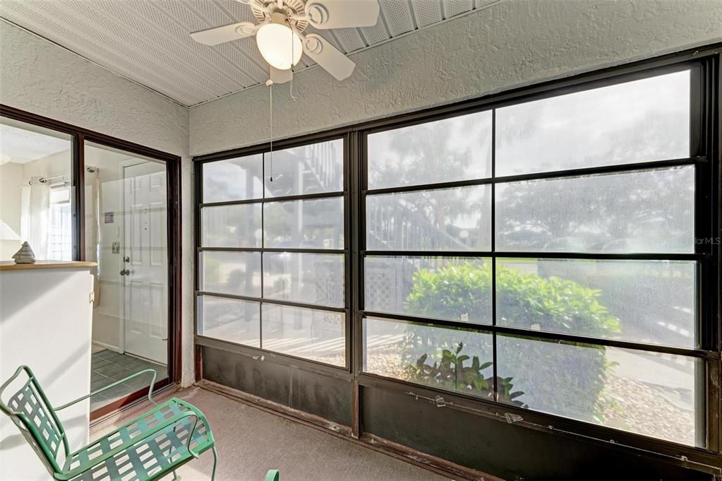 Porch has vinyl windows that can be opened for a screened porch.