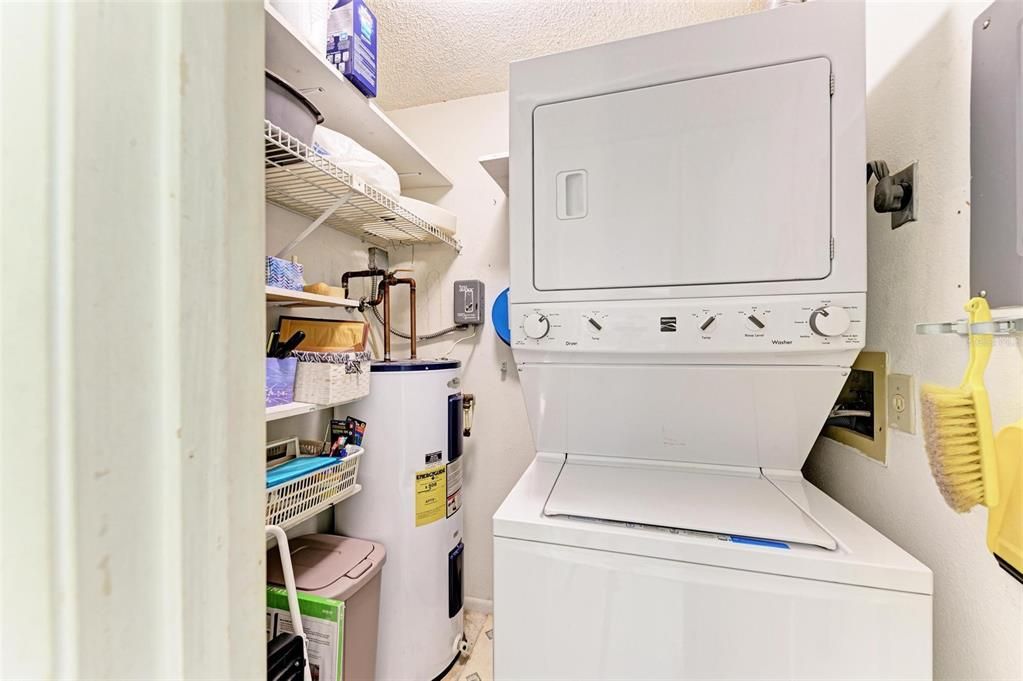 Laundry Room in hall between guest bedroom and bath.