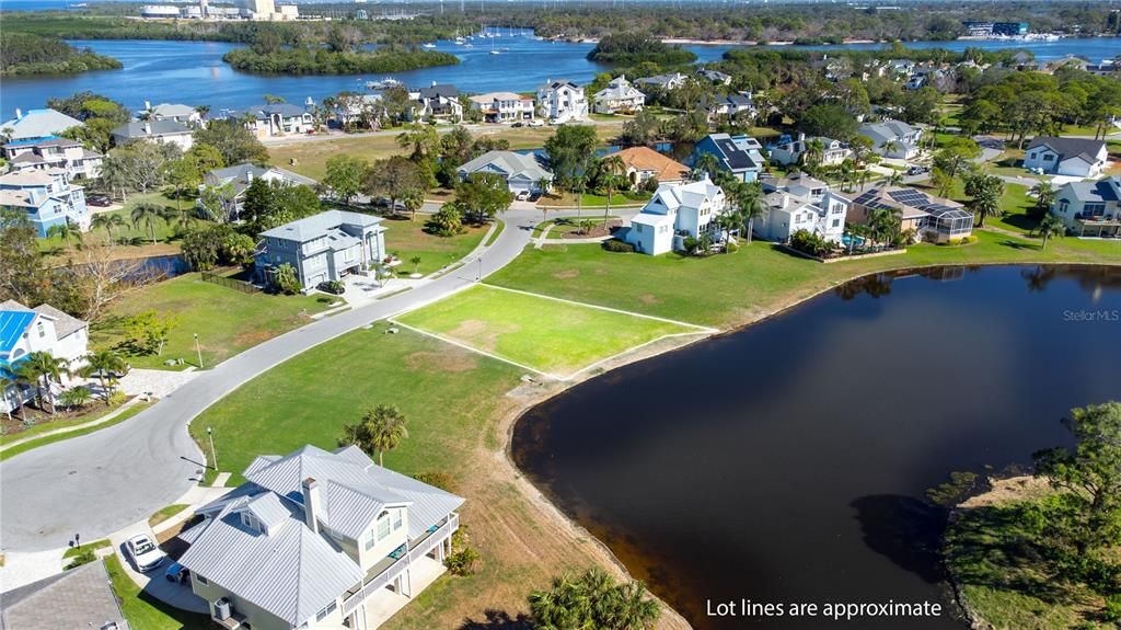 Beautiful lot with sweeping pond views in the gated Harbour Watch Community.