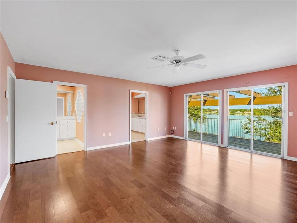 boasting extras like a private balcony and TWO separate bathrooms.