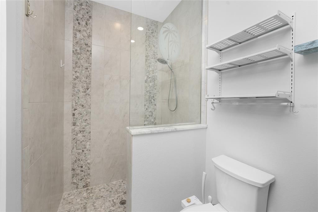 Guest Bathroom with door to Pool/Lanai (Pool Bath)