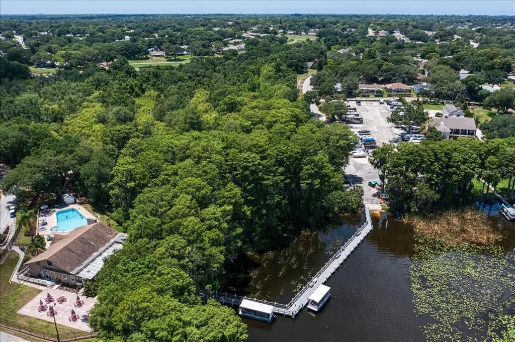 Lake Tarpon Lodge connected to RV & boat ramp by an open dock & fishing pier~