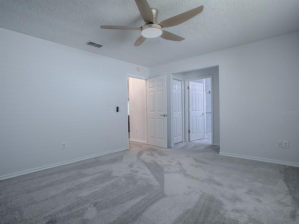 PRIMARY BEDROOM WITH LARGE WALK-IN CLOSET AND EN-SUITE BATH.