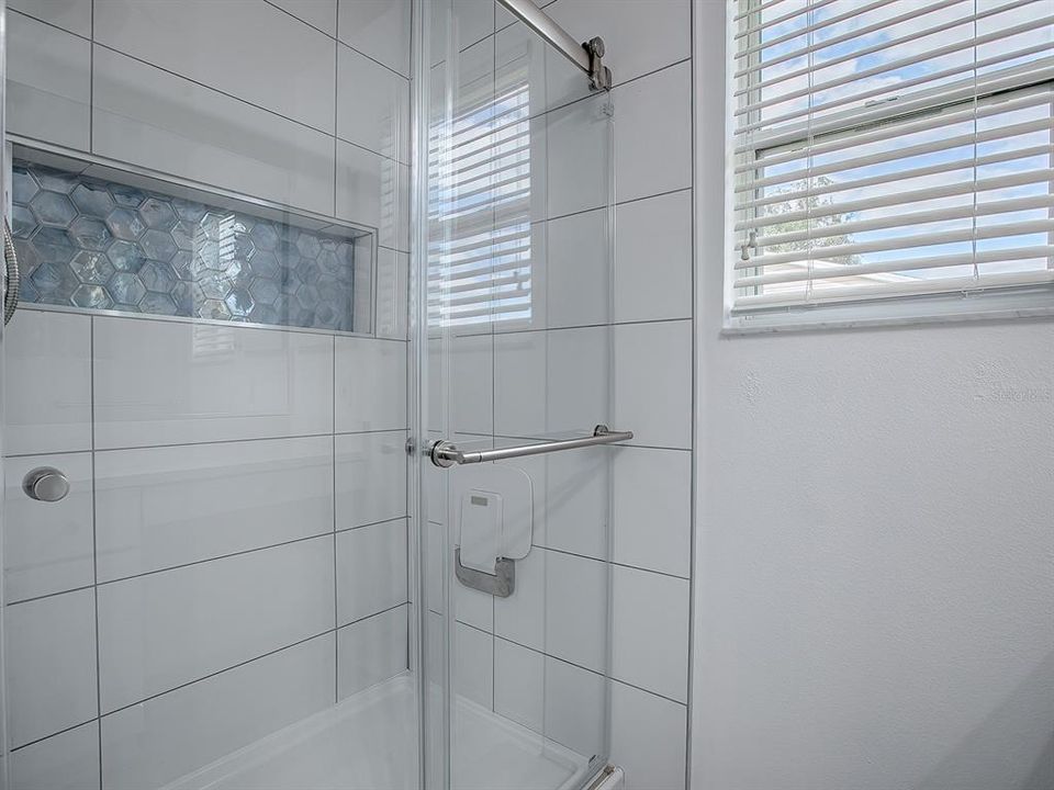 LOVELY TILED SHOWER WITH CUSTOM NICHE.