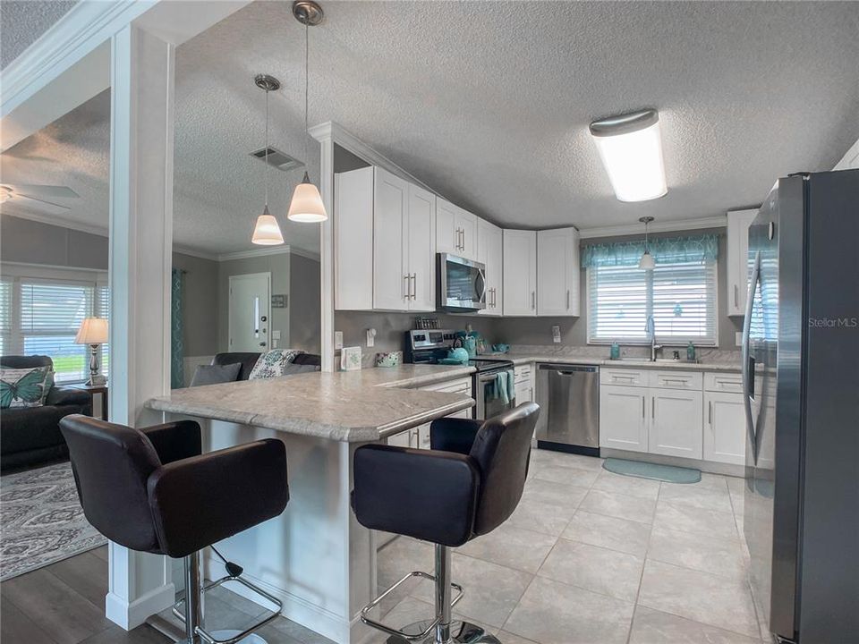 Gorgeous updated kitchen where cabinets and countertop space is abundant