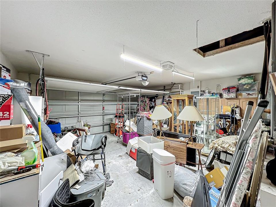 Large 2 car garage with screen door.