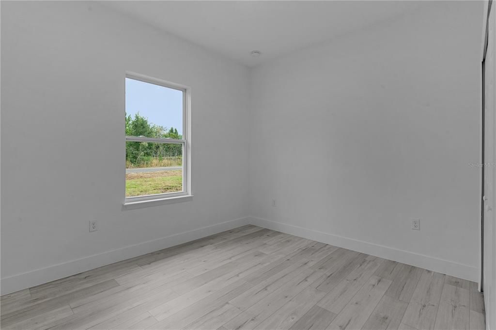 Bedroom 3 with window facing side road