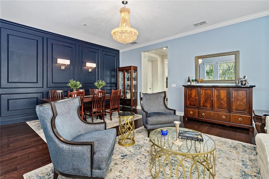 Looking toward the dining room and entry to guest half bath and kitchen