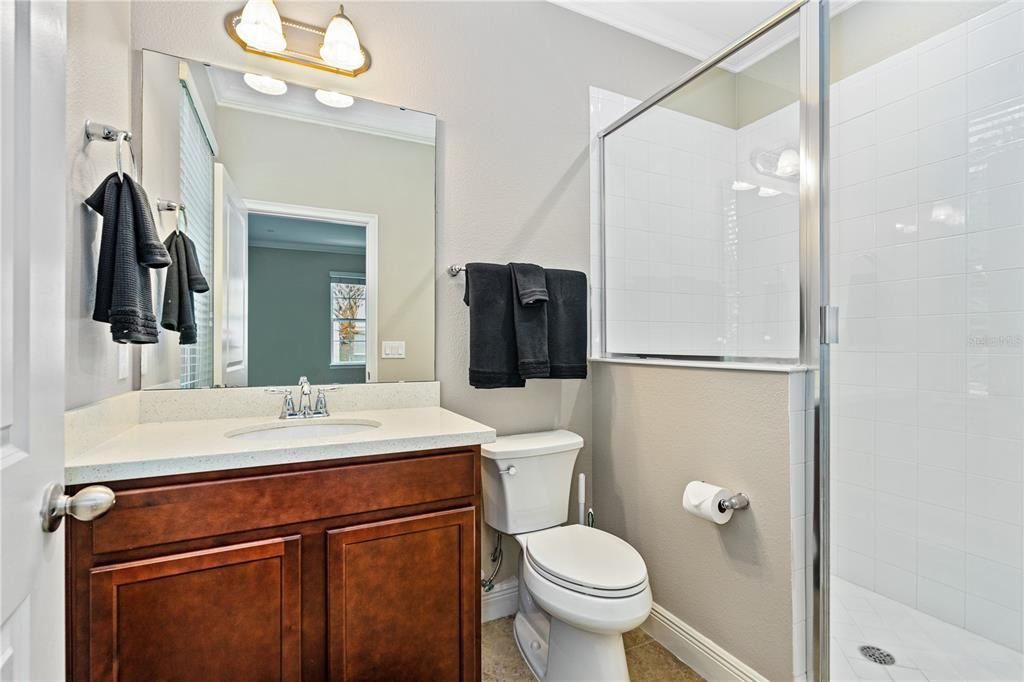 En-suite with quartz counters and new Kohler toilet