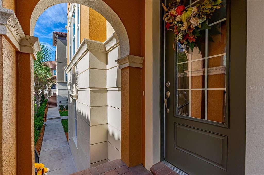 Welcoming covered front porch with 8ft door