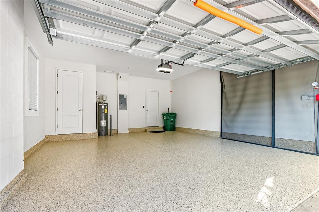 Garage features new epoxy coated floor, refreshed paint on walls and ceiling; Garage door has new rollers and springs plus a "smart" garage door opener (myQ system) with camera and motion-sensing light