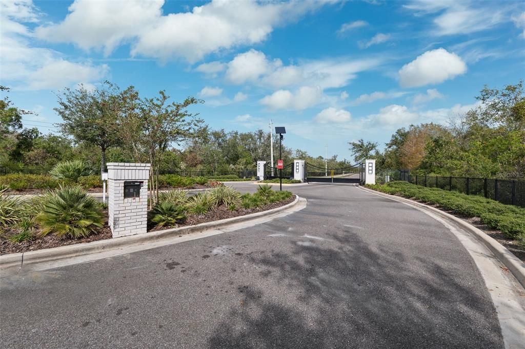 Gated community with lush greenery and conservation land.