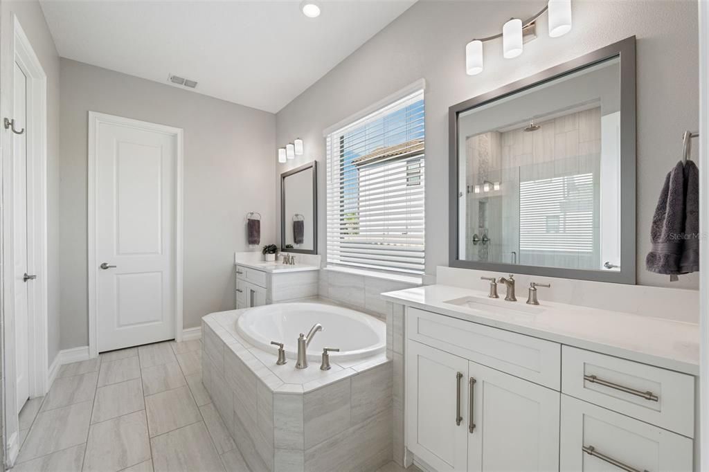 Primary bathroom offers a soaking tub for ultimate relaxation.