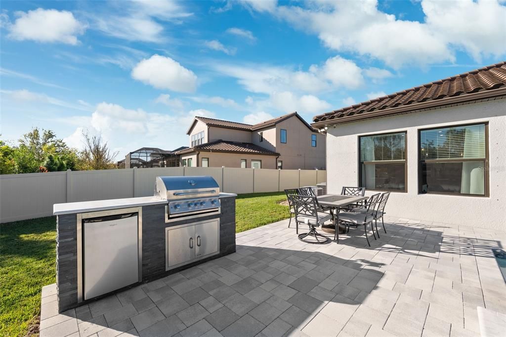 Outdoor grill and bar fridge for entertaining family and guest.