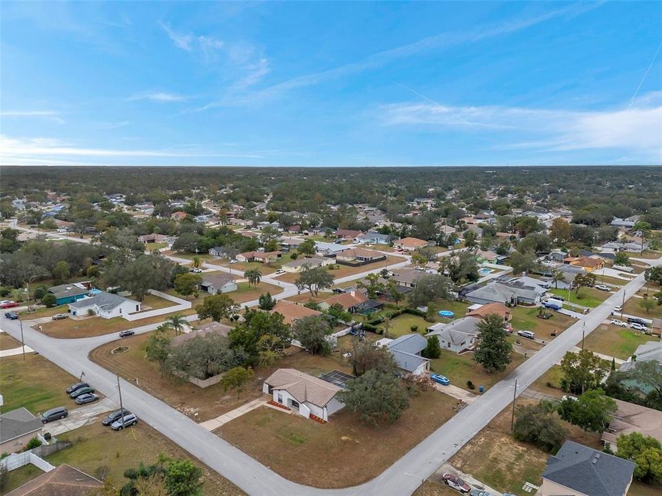 Stunning aerial view showcasing the expansive property, including the large yard, and home