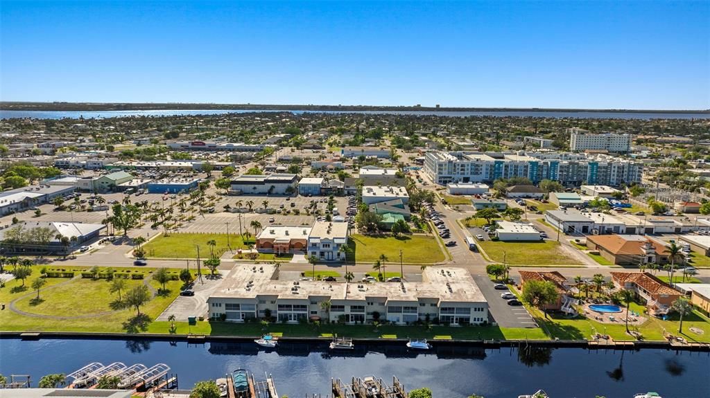 Birds eye view of property with a water view