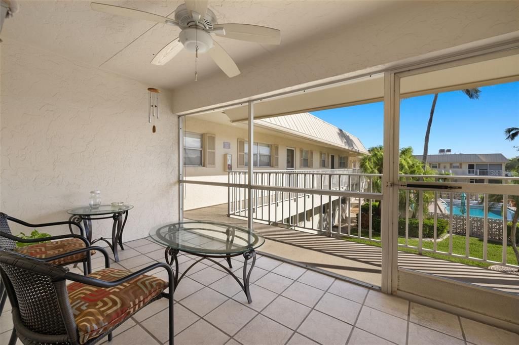 Screened balcony offers great views of the pool