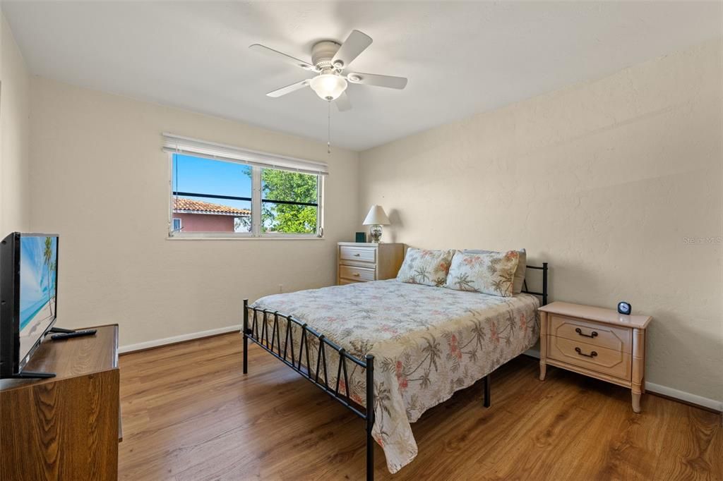 Bedroom with wood-style floors and ceiling fan