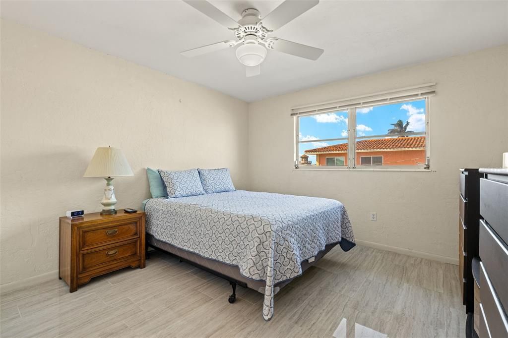 Primary Bedroom, window has views of the canal