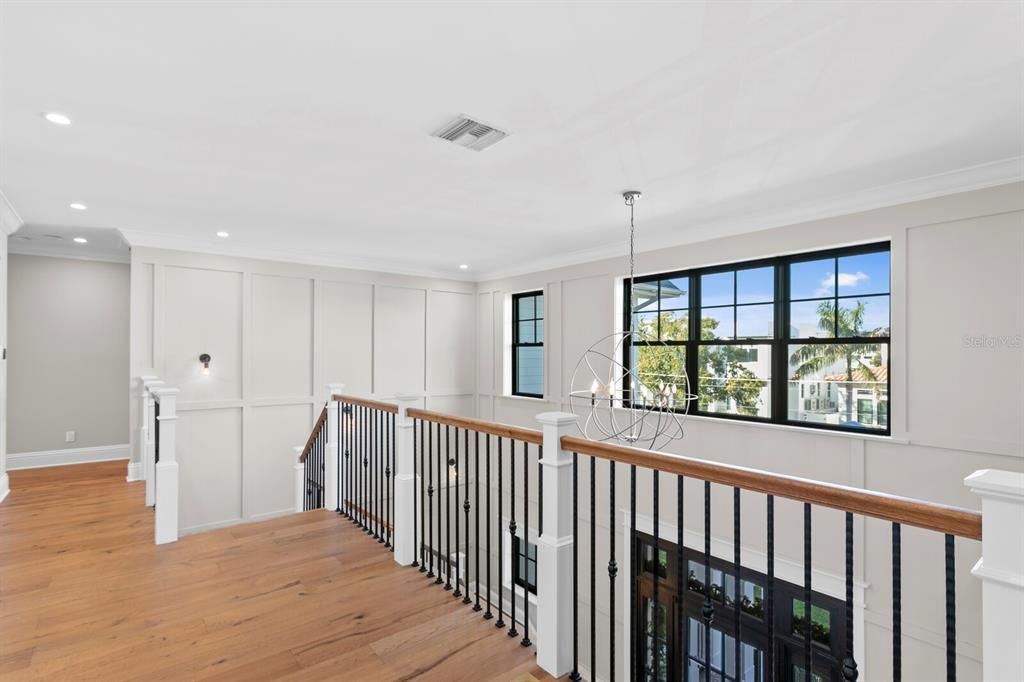 Two story open foyer with European oak stairs