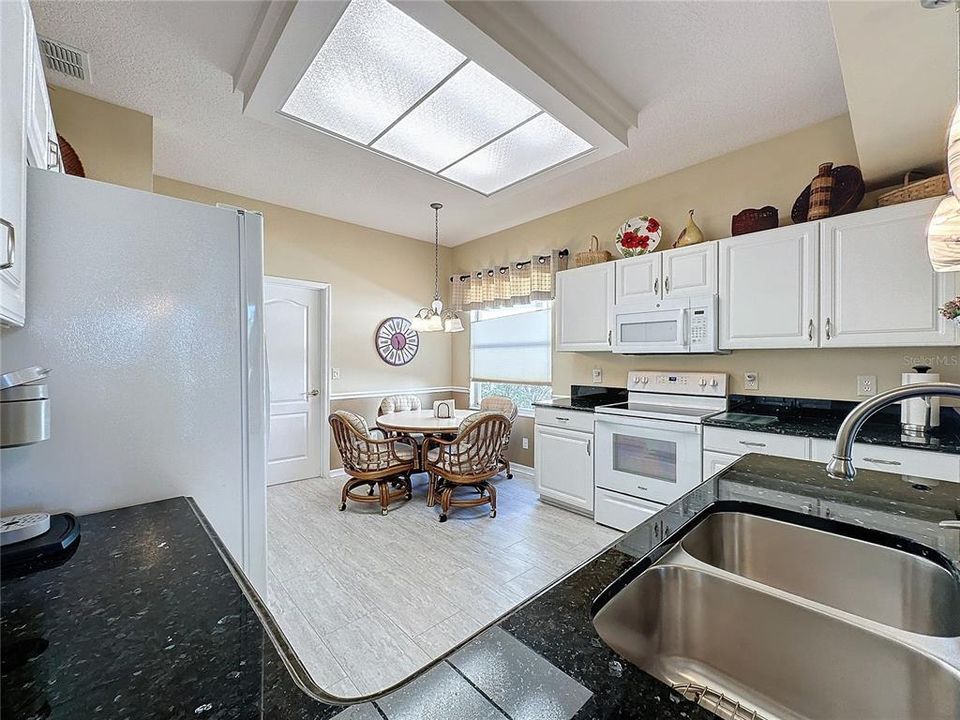 Kitchen has Granite countertops and stainless sink