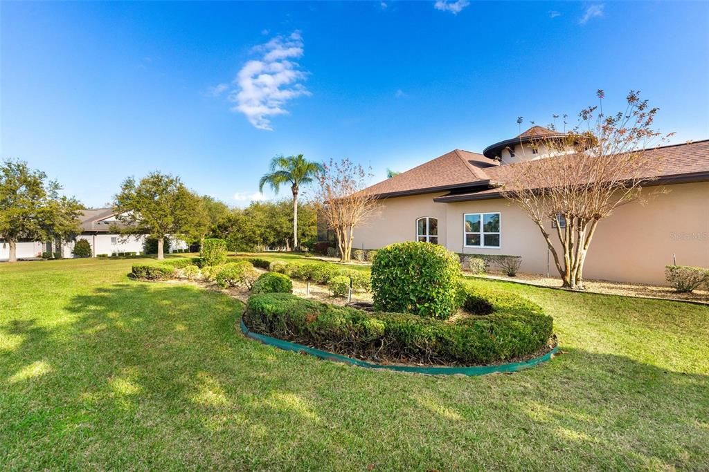 Side lawn view to include subdivision common area...