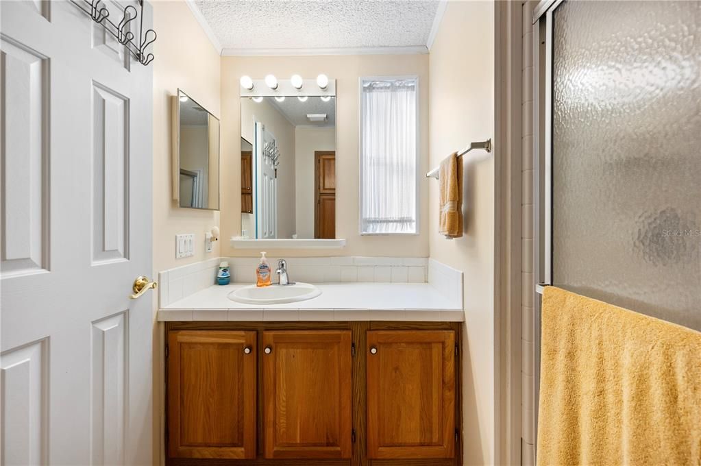 Guest bedroom with built in storage and closet