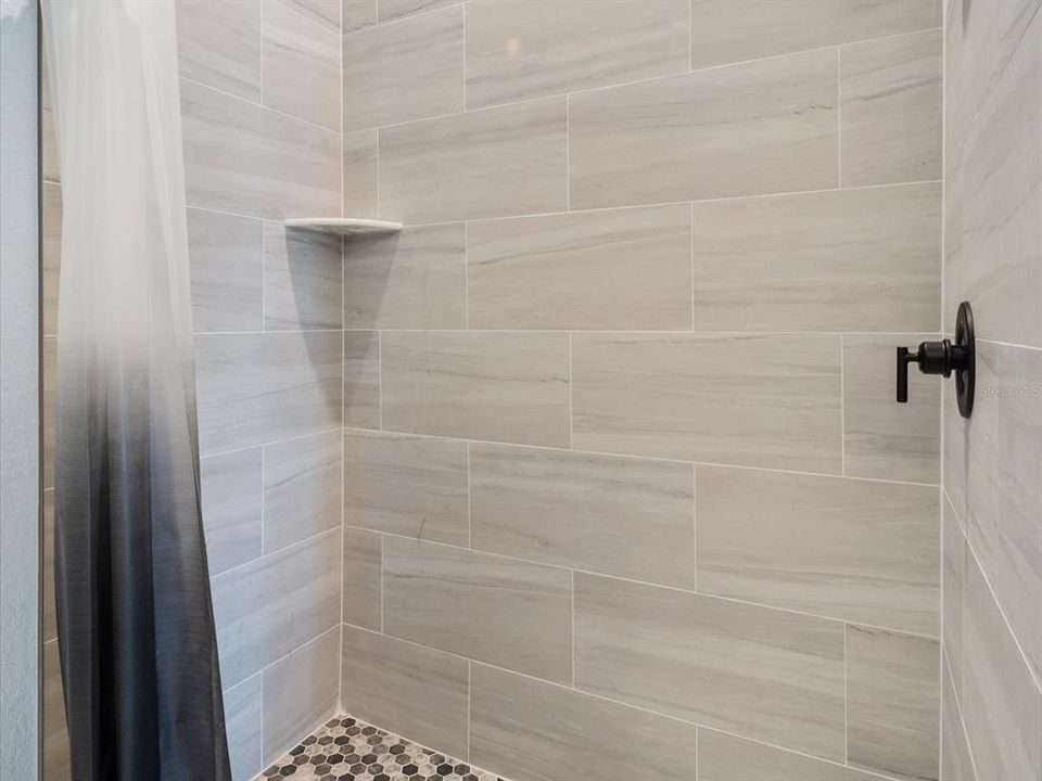 Guest bathroom fully tiled shower