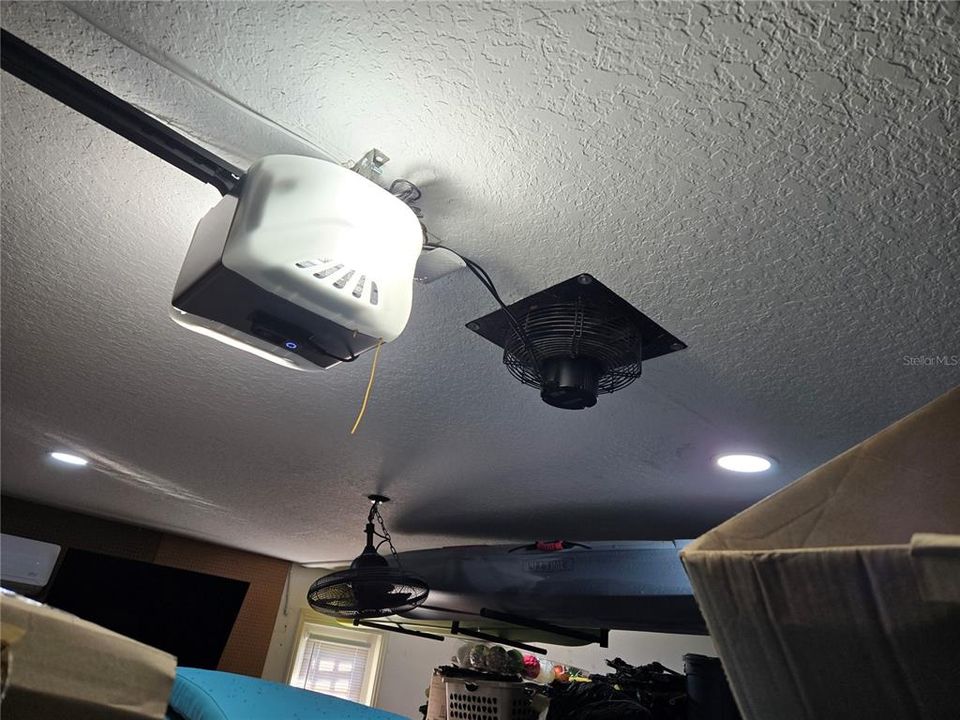 NEW garage door opener with fan.