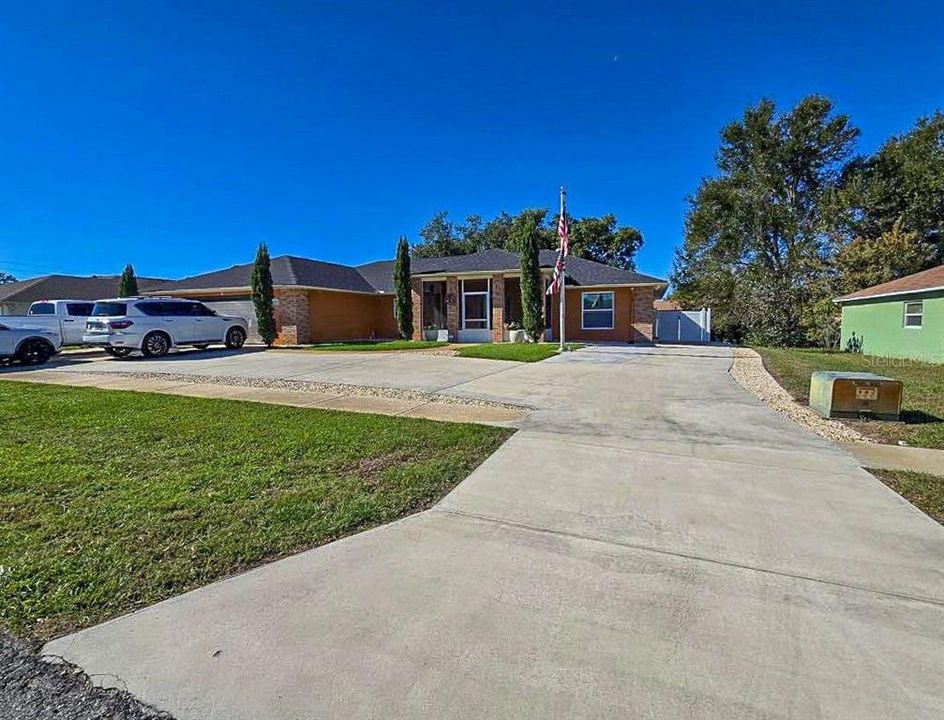 Long Length Driveway on left side of house with RV/Trailer/Golf Cart Parking. RV plug