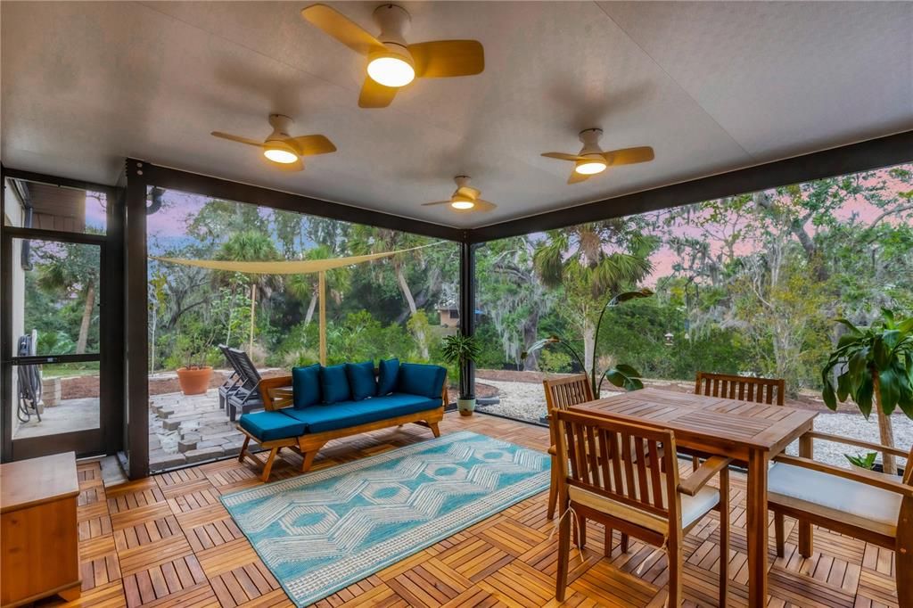 Newly screened-in lanai with a hardwood flooring.