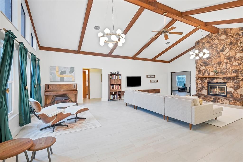 Spacious great room with vaulted ceilings sets the stage for the beautiful home.