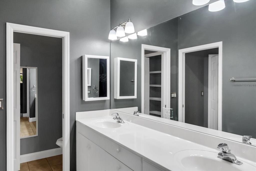 Master bath with separate commode area.