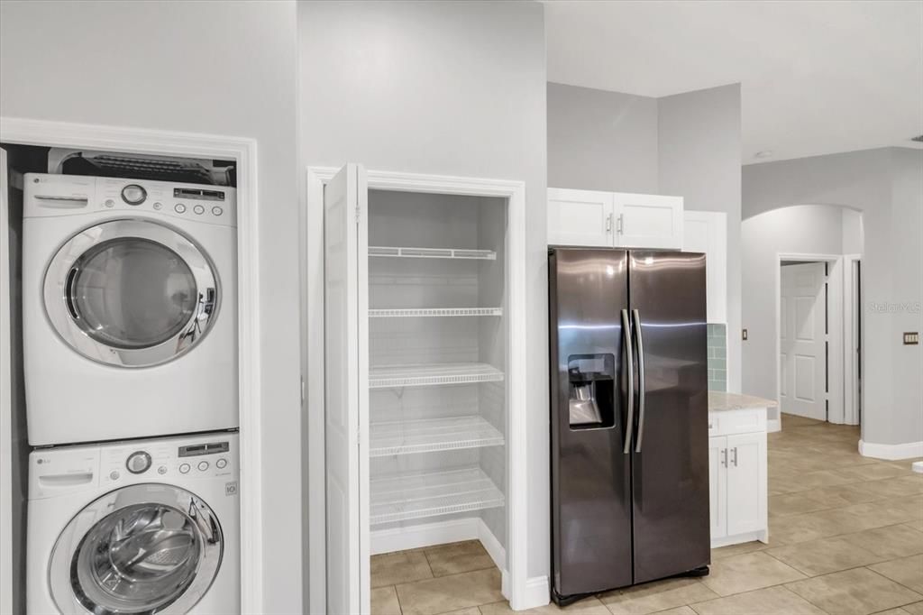 Kitchen pantry and laundry closet.