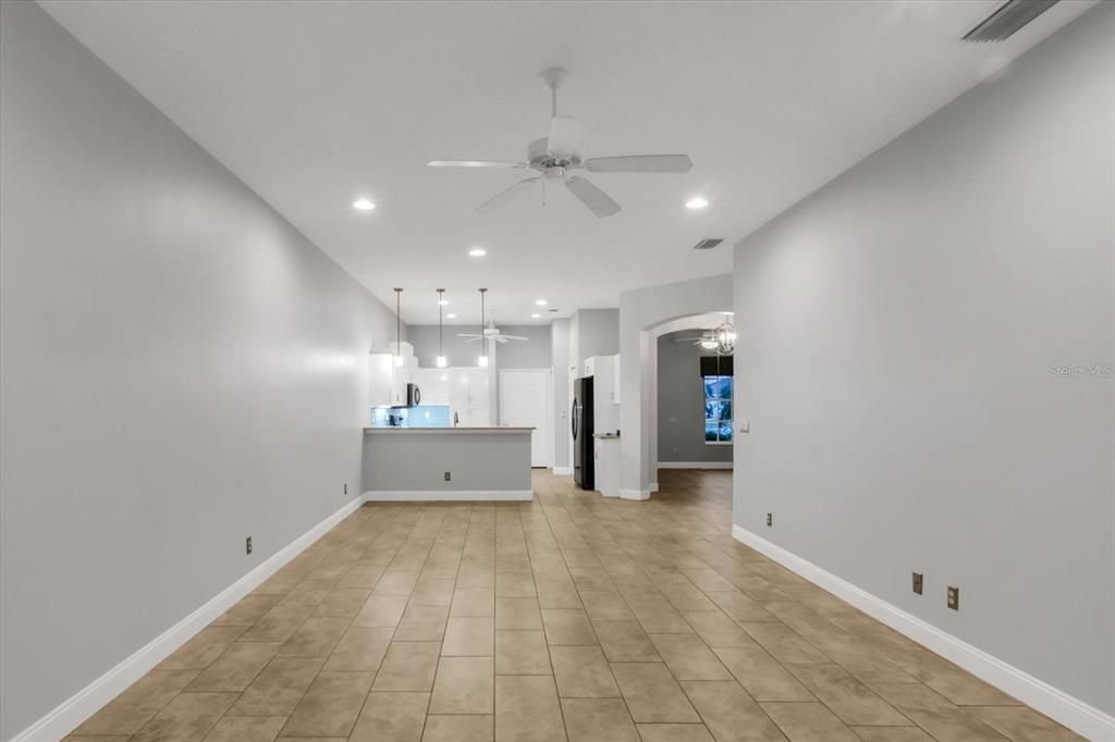 Living room with Kitchen in background view