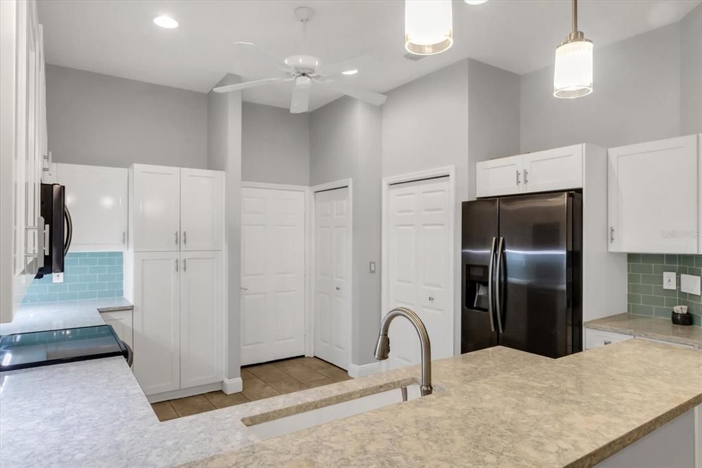 Kitchen close-up + Quartz countertops + Seaglass backsplash + Cabinets