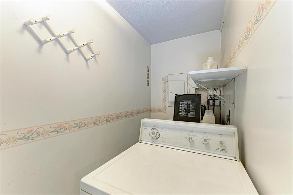 inside washer dryer room near primary bedroom