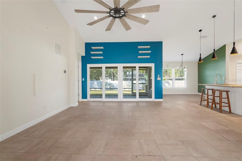 Large living room with open concept and vaulted ceiling.