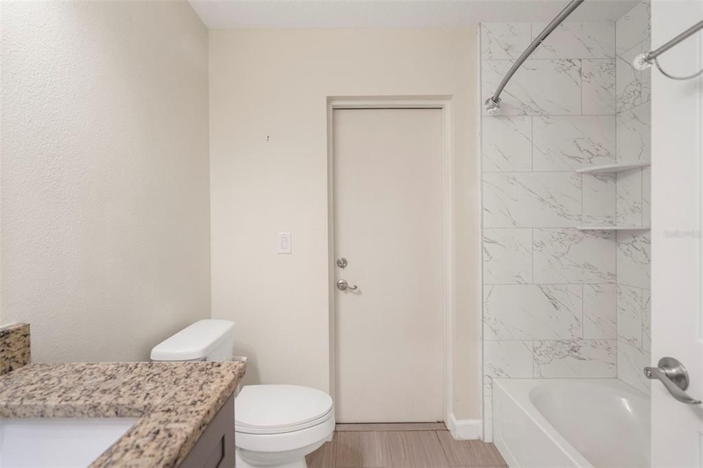 Guest bathroom with shower/tub combo.