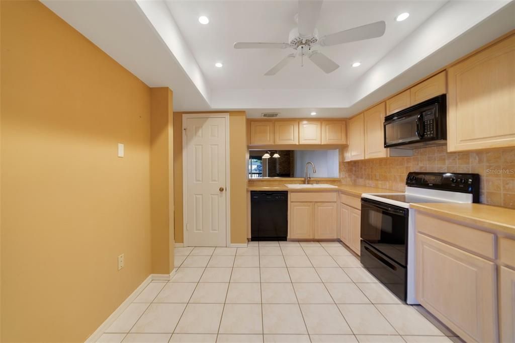 Another view of the kitchen with closet pantry