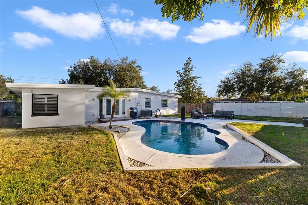 The corner lot, mature trees, open pool and patio are the backyard dreams are made of - bring your market lights, grill and spend weekends entertaining family and friends under the stars.